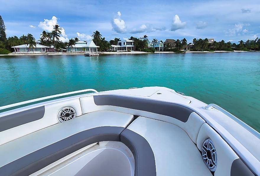 Private boat docked near Rum Point Resort, offering scenic coastal views