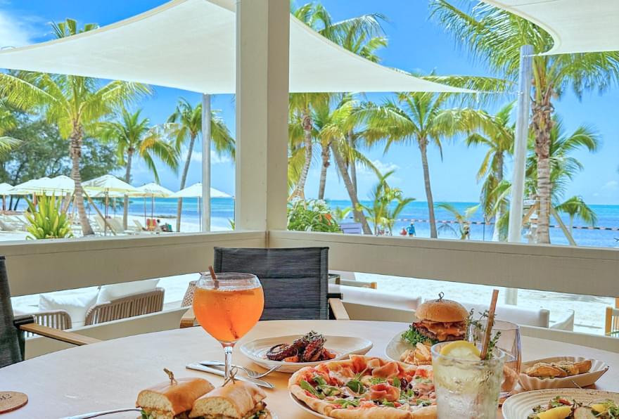 beachfront dining and tropical view at rum point grand cayman