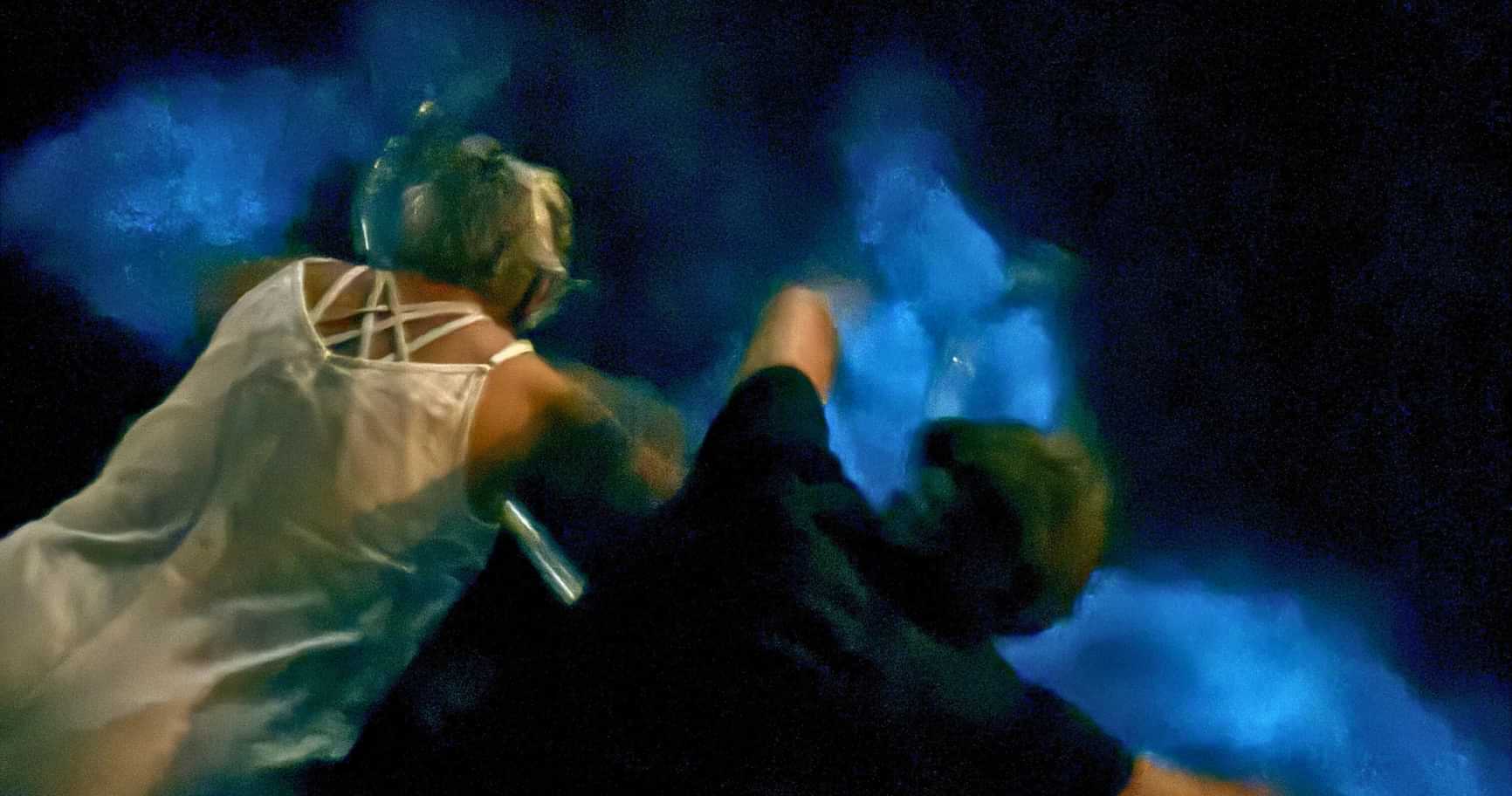 people experiencing a bio bay grand cayman in glowing water